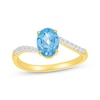 Thumbnail Image 1 of Oval-Cut Swiss Blue Topaz & Diamond Bypass Ring 1/10 ct tw 10K Yellow Gold