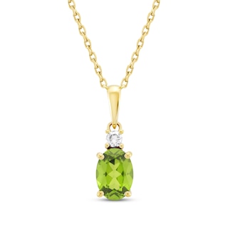 TETRA new year charm necklace in 18KT yellow gold with emerald and a chain  in 14KT yellow gold