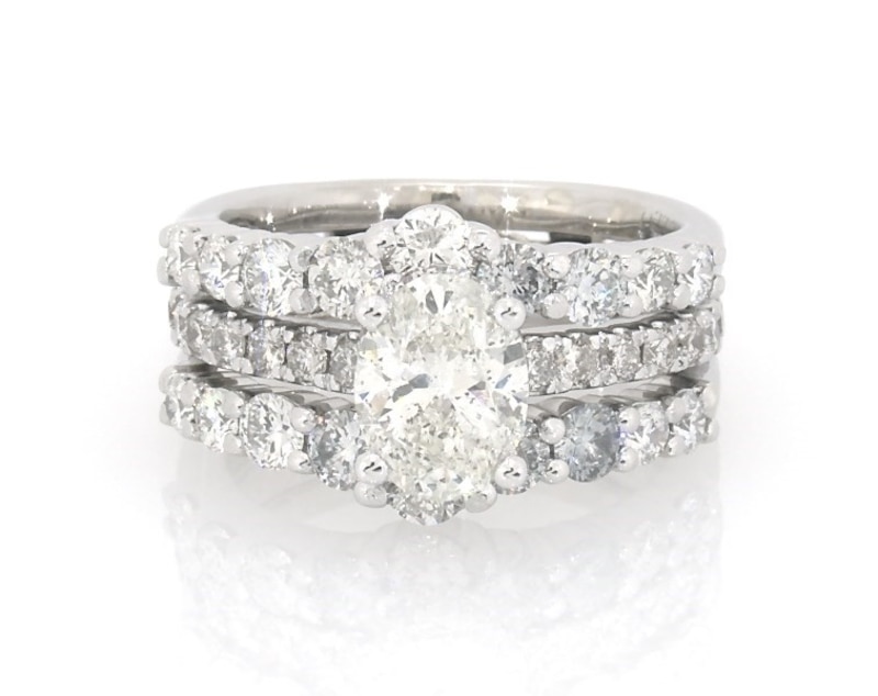 Main Image 1 of Previously Owned Oval-Cut Diamond Hidden Halo Bridal Set 2-1/4 ct tw 14K White Gold Size 4.25